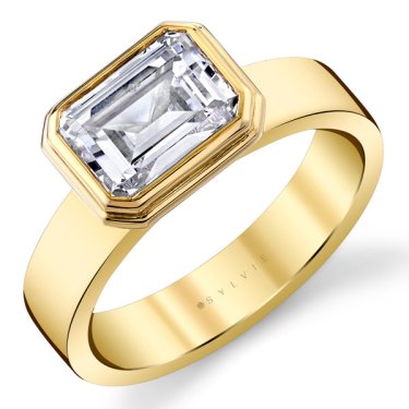 Auravie flat edge bezel solitaire engagement ring in 14k yellow gold, $2,680 (setting only); Sylvie Jewelry