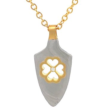 Four Hearts Yanone pendant in Damascus steel and 18k yellow gold with lab-grown diamond, $1,045; Chris Ploof 