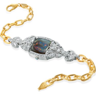 Vintage watch face in platinum and 14k yellow gold link bracelet with black opal