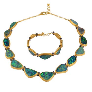 Necklace and bracelet in 24k yellow gold with Australian black opal doublets, diamonds, and sapphire beads
