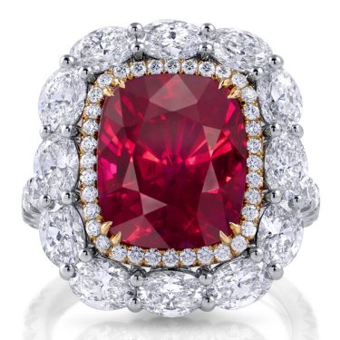 Ring in platinum and 18k yellow gold with 10.09 ct. cushion ruby, 2.92 cts. t.w. oval diamonds, and 0.84 ct. t.w. round diamonds, price on request; Omi Privé 