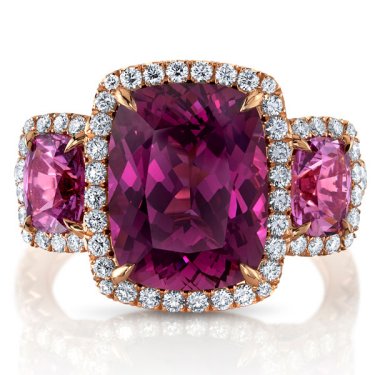 Three-stone ring in 18k rose gold with 6.17 ct. cushion purple spinel, 1.7 cts. t.w. cushion pink sapphires, 0.11 ct. t.w. round pink sapphires, and 1.14 cts. t.w. diamonds