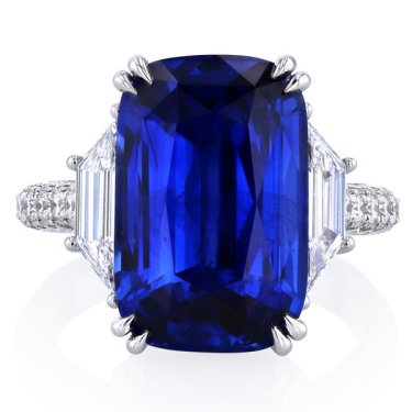 Ring in platinum with 10.5 ct. cushion sapphire, 0.59 ct. t,w. trapezoid diamonds, and 0.93 ct. t.w. diamonds