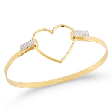 Bangle in 14k yellow gold with 0.16 ct. t.w. diamonds, $2,625; I. Reiss 