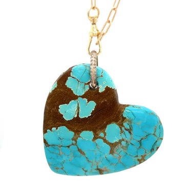 Heart pendant in 14k yellow gold with 141 ct. Kingman turquoise and diamonds, $3,775; Just Jules 