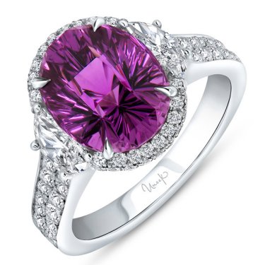Halo ring in 18k white gold with 4.64 ct. umbalite garnrt, 0.64 ct. t.w. half moon diamonds, and 0.64 ct. t.w. round diamonds, $15,995; Uneek 
